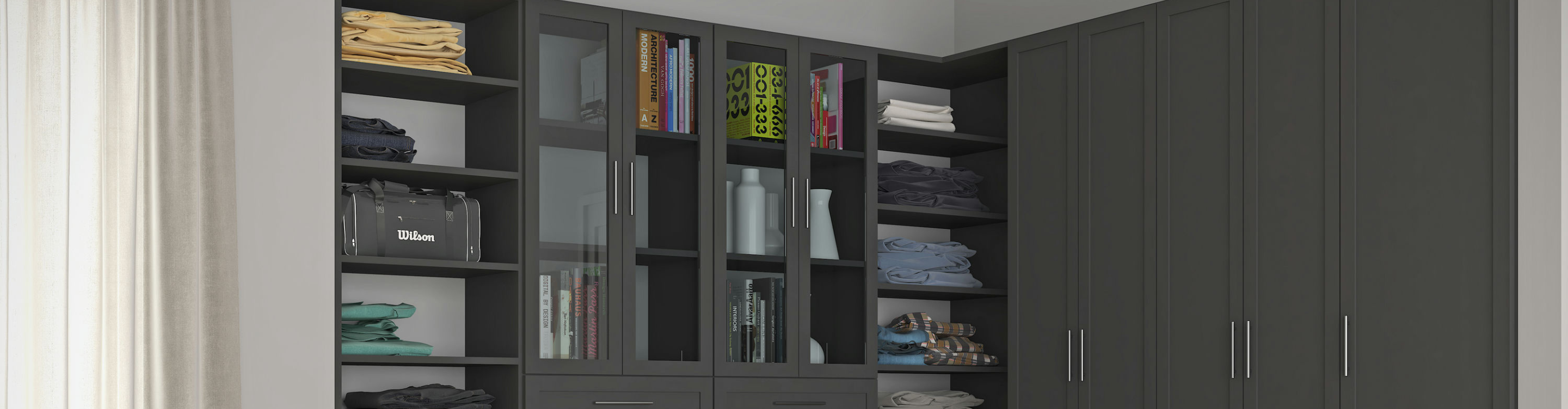 Custom closet, gray cabinets, clothes and bags in shelves. 